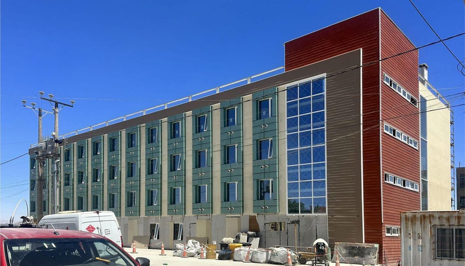 A four-storey hotel assembled from factory-built modules, photographed during fit-out